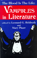 Cover of The Blood Is the Life is dark blue and red with a photo of a vampire lifting up its cape.