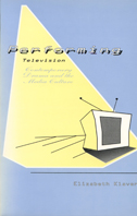 Book cover is light blue and yellow, with yellow "light" shining down on a television.