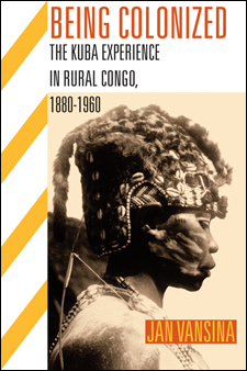 The cover of this book is white, with yellow stripes, and an image of an African in a beaded headress.