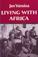 cover of Vansina's book is a deep red, with white type and a duotone photo of five African men seated on the ground.