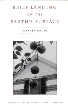 Brunk's book is white with a black and white image of a round fruit hanging off a branch in front of a house