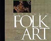 The cover of Folk Art is a grey-brown with a color photo and the title large and in white.