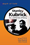 Depth of Field: cover art of a black and white photo of Stanley Kubrick, cropped into a circle, set upon a background divided evenly with blue on the top and orange on the bottom.