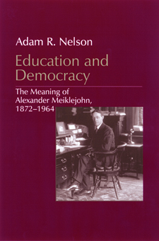 cover image of Education and Democracy by Adam R. Nelson, featuring an old photo of Meiklejohn at his desk.