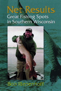 the cover of Net Results is green, with a photo of the author holding up a huge fish.