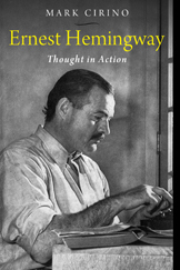 Black and white image of Ernest Hemingway working at his typewriter
