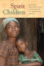 Spirit Children: Cover showing a black woman with a black child resting his head against her shoulder. Above them, the title text is written in red and green font, sitting inside a tan block. 