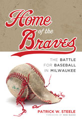 Book Cover: Home of the Braves. Cover art of an unraveling, old baseball, set over a bisected brown and white backdrop.