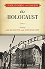 Understanding and Teaching the Holocaust: cover art of a black and white photograph of the entrance to Auschwitz, a gate reading Arbeit Macht Frei meaning work sets you free. Above the photograph is a a block the color of aged paper, which proclaims the title and editor text.