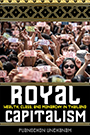 Royal Capitalism: A large group of people hold up various denominations of Thai baht banknotes.