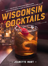 Wisconsin Cocktails: Cover art showing a brandy old fashioned, including a cherry and orange rind, sitting atop of table. The background of the image is heavily blurred, matching the warm tones of the cocktail. The title text is proclaimed in bold orange text at a slight angle, with delicate white lines above and below it.