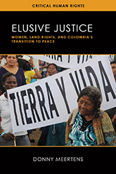 Elusive Justice: Cover showing a woman standing in front of a sign that reads 'TIERRA Y VIDA' (Earth and Life) at a protest.
