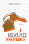 A Milwaukee Inheritance: Cover showing an artistic depiction of key attached to a house keychain, colored gray, and repeated in a slightly offset orange. Behind this image is a white map of Milwaukee. The title text alternates orange and gray, mimicking the coloration of the key and house keychain.