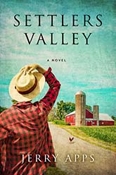 Settlers Valley: Cover showing a man wearing a red plaid shirt and a wide brimmed hat standing before a dirt road, a red barn along the horizon.