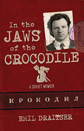 In the Jaws of the Crocodile: Cover showing a red background with a darker red band towards the bottom, containing Russian letters. At the top right corner of the cover is a black and white photograph of Emil Draitser as a young man wearing a suit and tie. The title text's font is gray and splotchy, like the font of a typewriter. Underneath the title text is a little crocodile symbol holding a pitchfork.