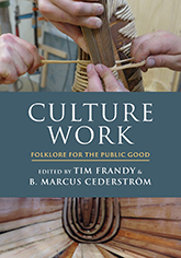 Culture Work: cover depicting a photograph of two sets of working together to weave upon a piece of furniture. The picture is cut off at the bottom with a large, blue block containing the title text. Beneath that title text is another image of a zoomed in photograph of a piece of wooden, indigenous art.
