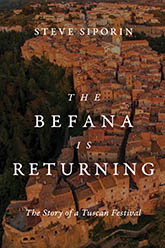 The Befana Is Returning: cover depicting an aerial view of Tuscany with a warm tone. The title text is written in delicate, white font over the image.