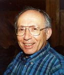 Photo of the author Gerd Korman. Korman is wearing a blue plaid shirt, and glasses. Photo credit" John McClymer.