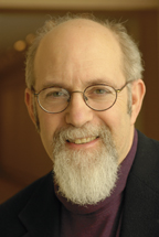 Photo of Stuart Levitan shows him in with glasses and a distinguished beard. 