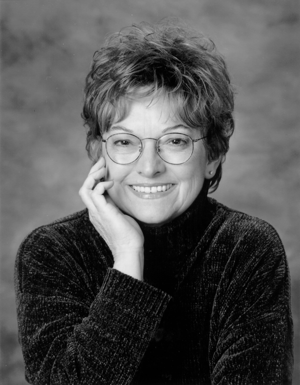 large photo of the author Sara Rath. She is wearing glasses, and a contemporary sweater